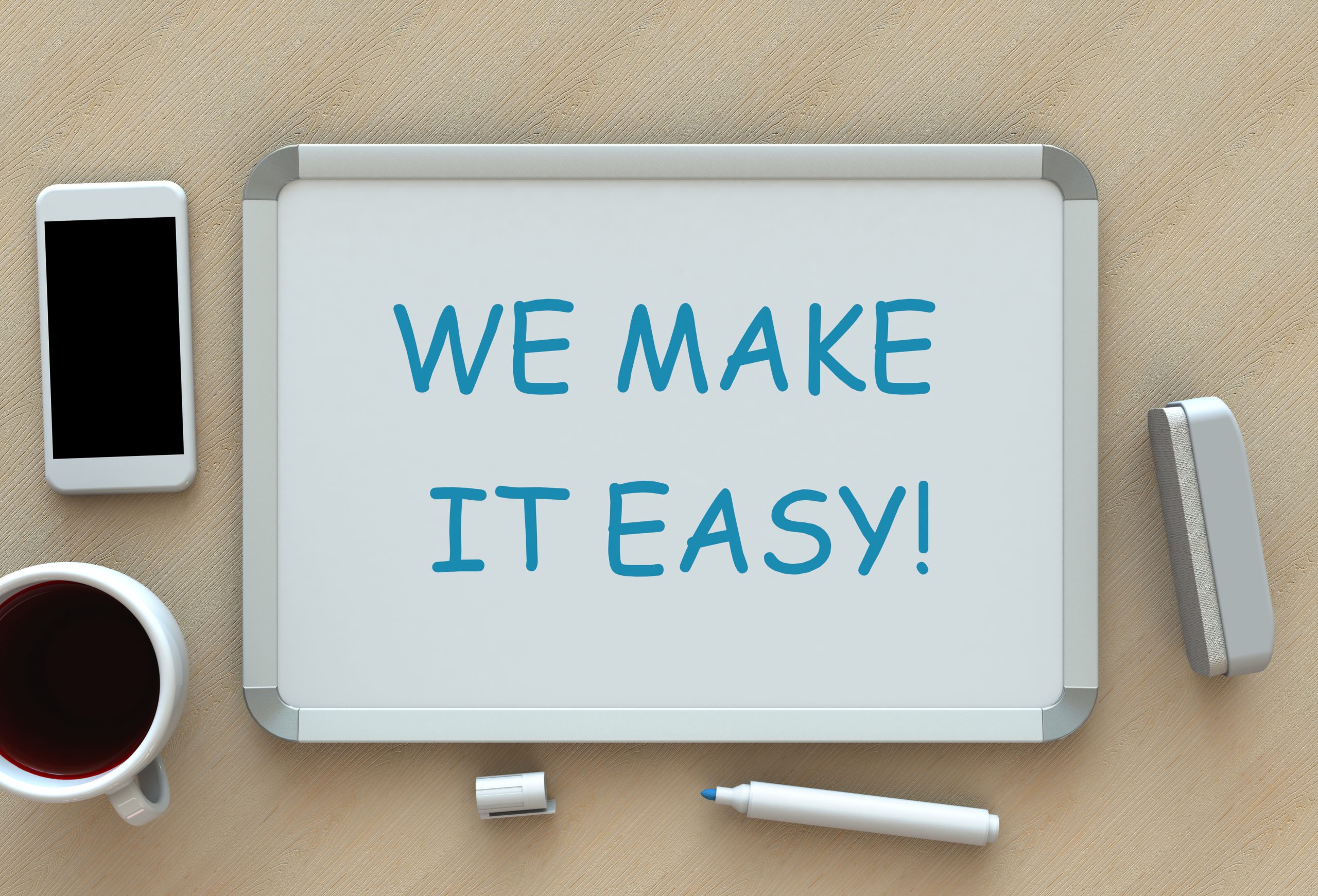 WE MAKE IT EASY!, message on whiteboard, smart phone and coffee on table